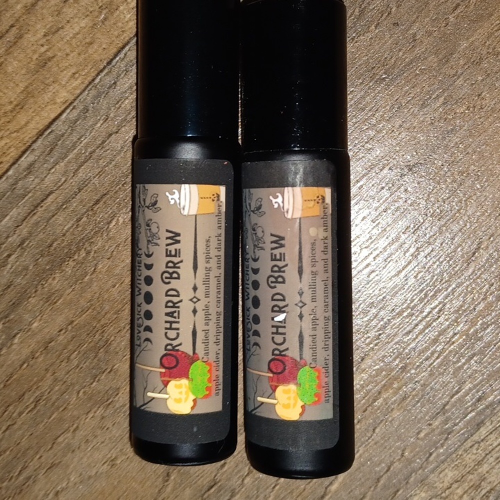 Two pack of roll on LoveSick Witchery Orchard Brew scent